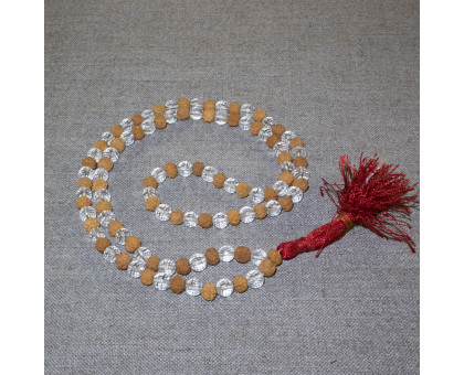 Rosary from white rudraksha and faceted crystal 